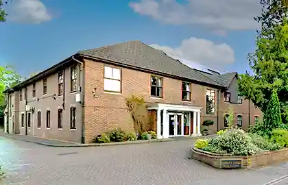 Exterior view of Corrina Lodge care home in Camberley