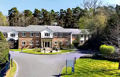 Exterior view of Holly Lodge care home in Frimley Green, Camberley