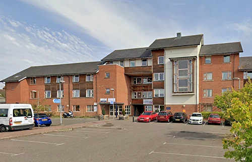 Exterior view of Mill River Lodge care home in Horsham